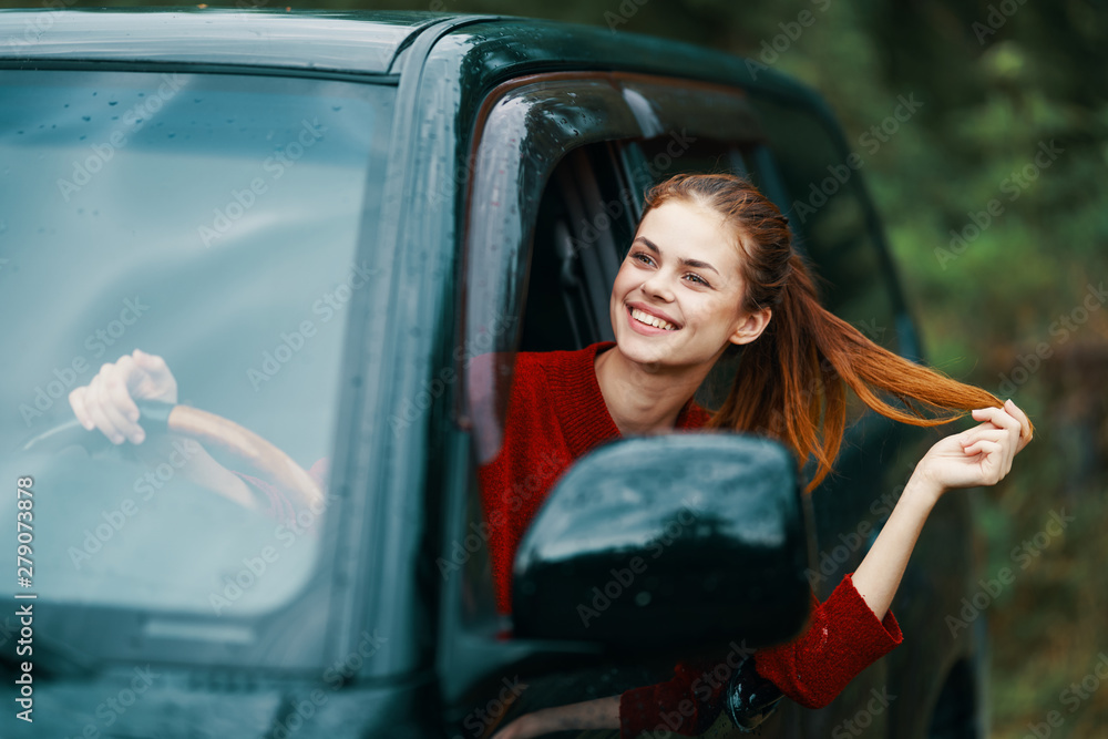 young girl in a red car young girl in a red car