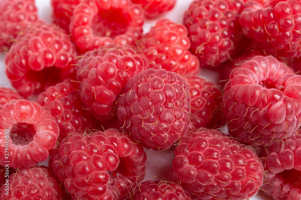 Fresh red raspberries on white background. Close Up. Fresh red raspberries on white background. Close Up.