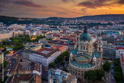 Budapest, Hungary - Aerial skyline view of Budapest at sunset with St.Stephen's Basilica. Buda Castle Royal palace and ferris wheel at background at the downtown of Pest