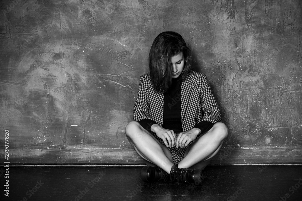 Psychology portrait of sad teen girl in room. Concept of young people life. Psychology portrait of sad teen girl in room. Concept of young people life.