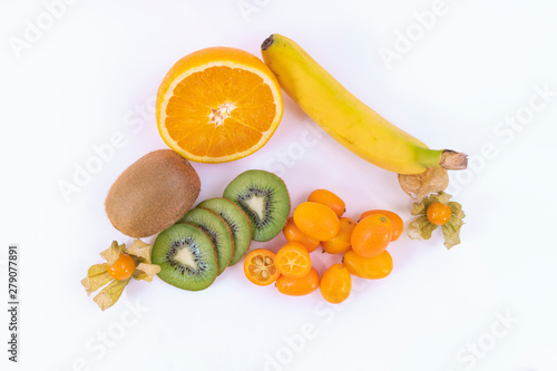Fototapeta Naklejka Na Ścianę i Meble -  Top view of a sweet and tasty tropical snack - Ripe oranges, green kiwi and banana