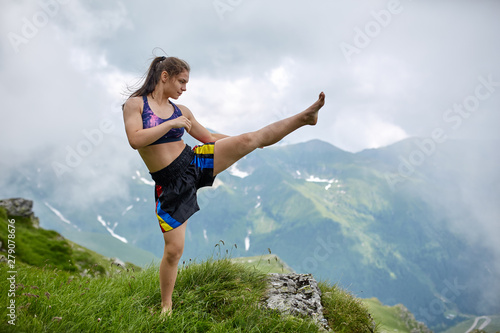 Kickboxing girl on the mountains