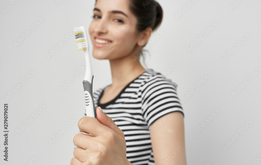 young woman with paint brush young woman with paint brush