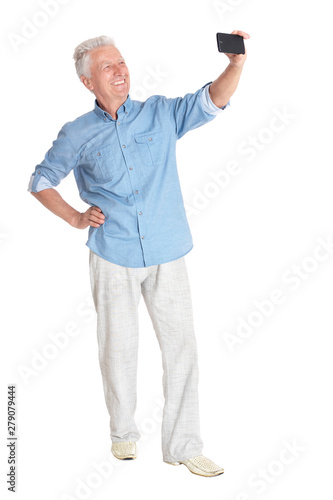 senior man taking selfie on white background