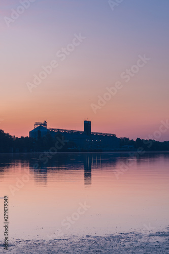 Sunset over the port. Evening over the river.