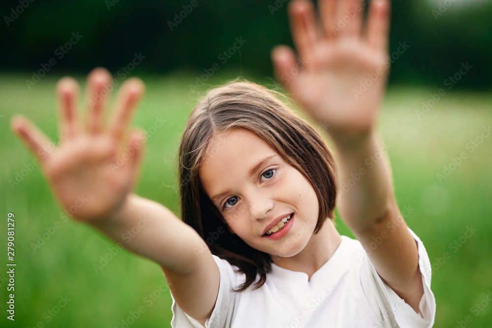 portrait of a girl with thumbs up