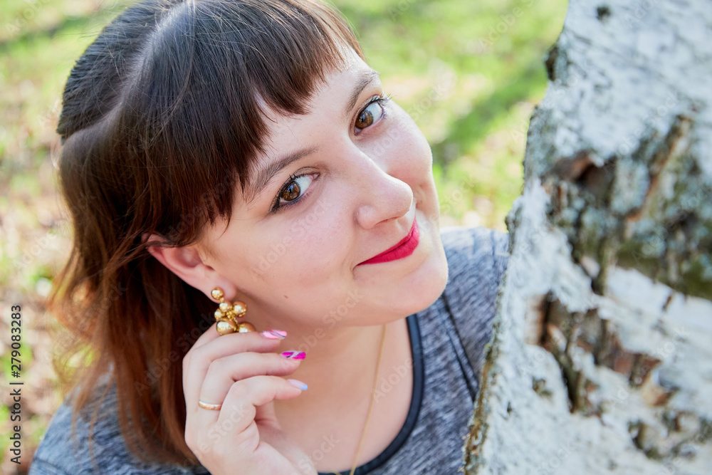 Portrait of beautiful cute girl in summer or spring park Portrait of beautiful cute girl in summer or spring park
