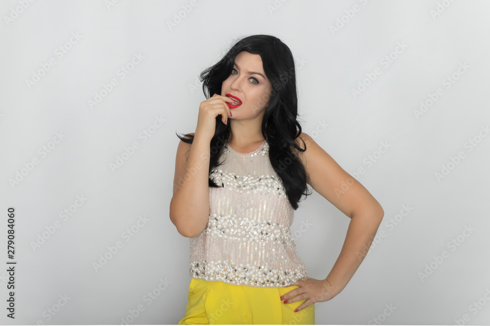 Portrait of a beautiful young brunette isolated on white background. Woman posing in the studio Portrait of a beautiful young brunette isolated on white background. Woman posing in the studio