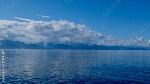 blue sky and sea and mountains