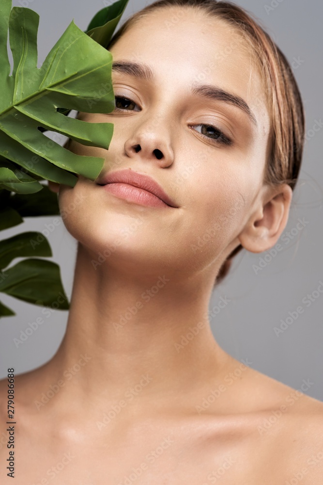 Portrait of woman looking at camera with perfect skin on her face Portrait of woman looking at camera with perfect skin on her face