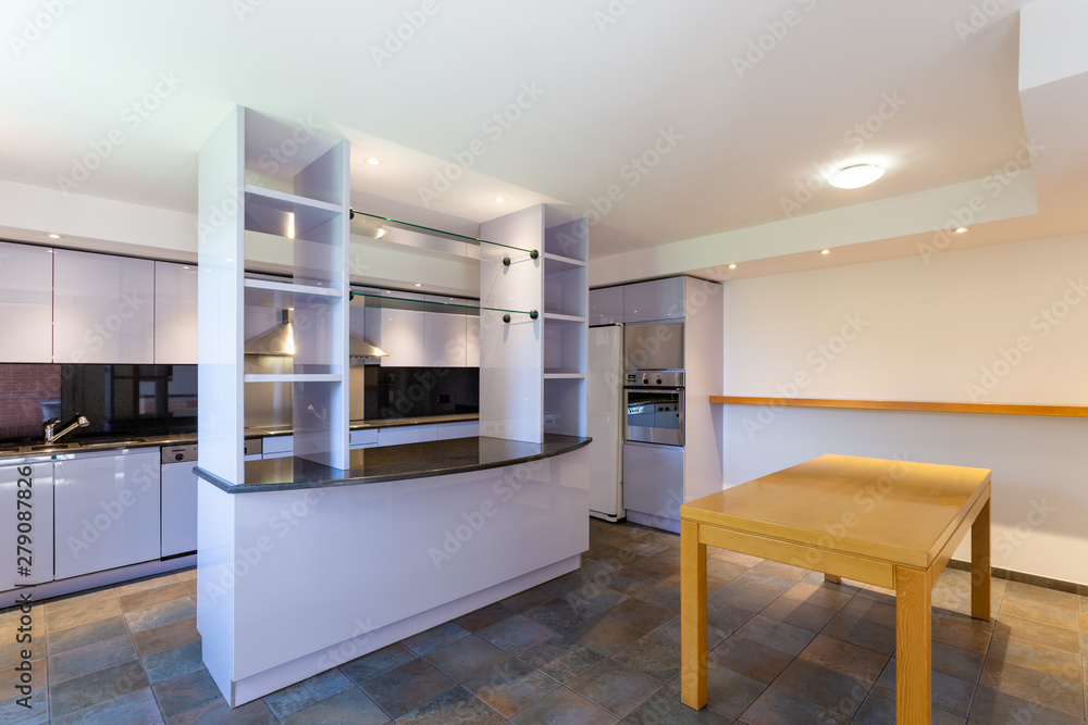 Modern lilac kitchen in luxury loft with modern appliances Modern lilac kitchen in luxury loft with modern appliances