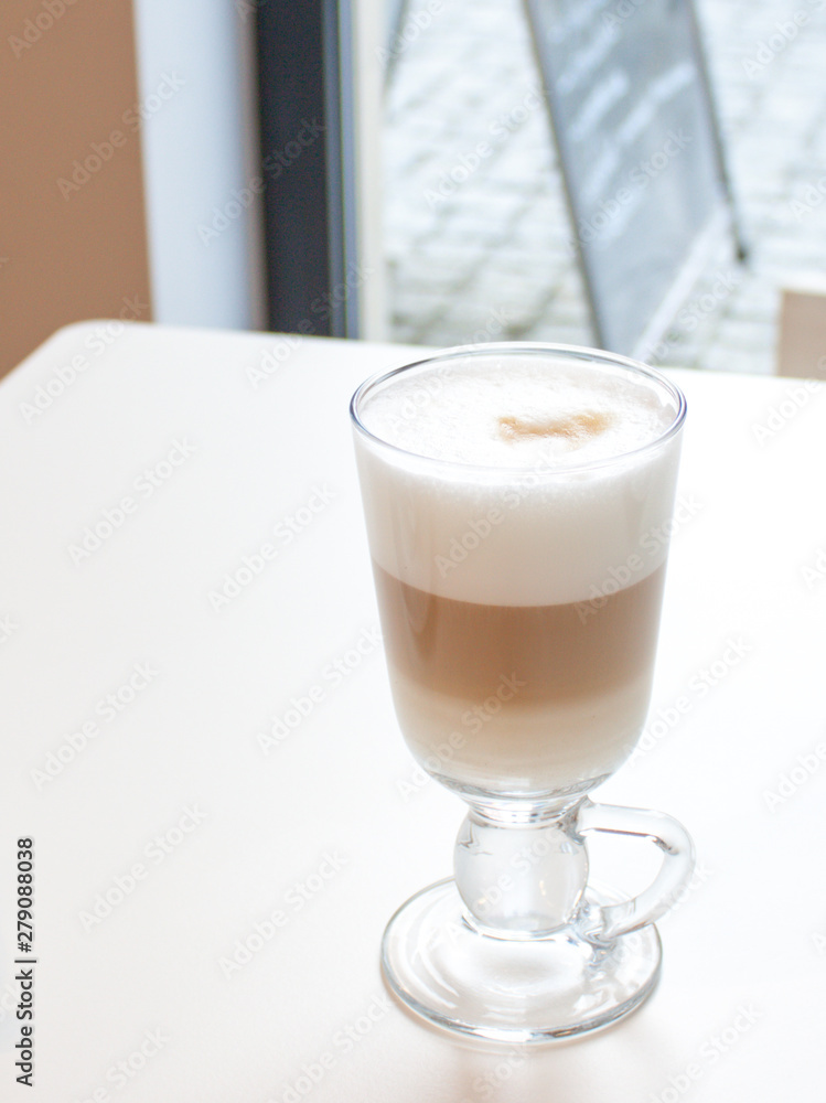 Coffee Latte in glass with great white foam. Coffee Latte in glass with great white foam.