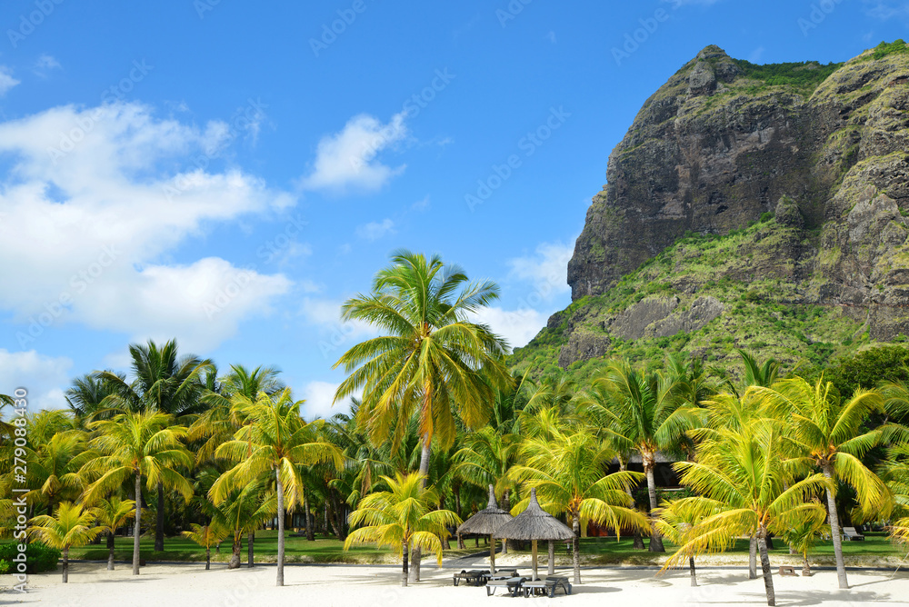 Beautiful sandy beach with Le Morne Brabant mountain on the south of Mauritius island. Tropical landscape. 