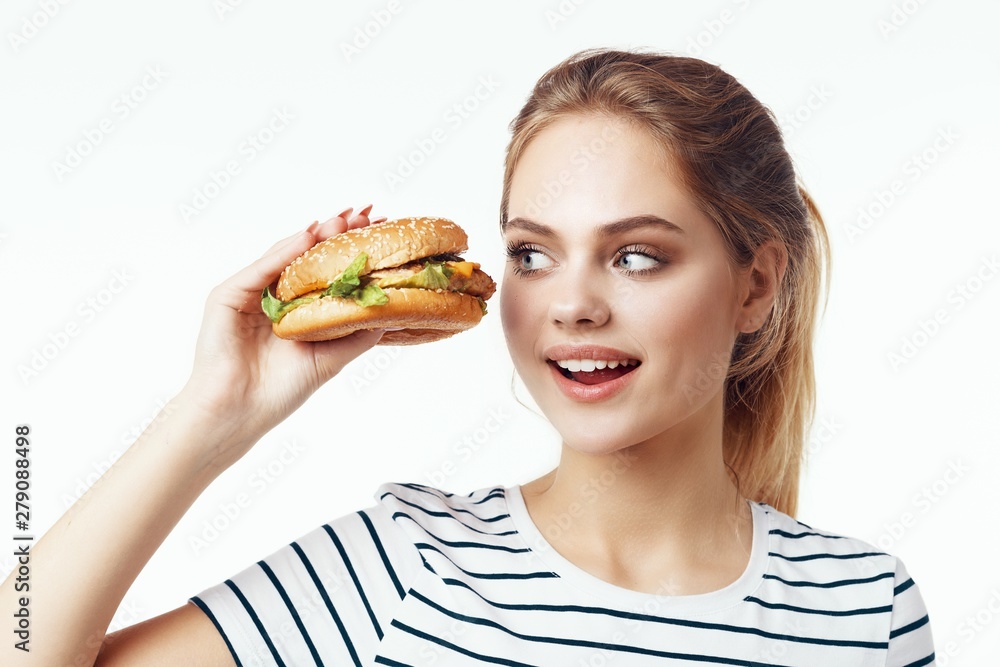 young woman with hamburger