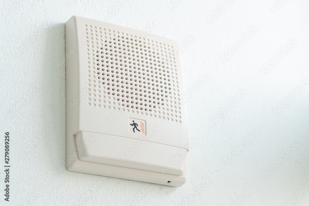 Emergency Fire Exit Speaker for sound siren alarm and announcement on wall,  safety equipment in interior office background Photos | Adobe Stock