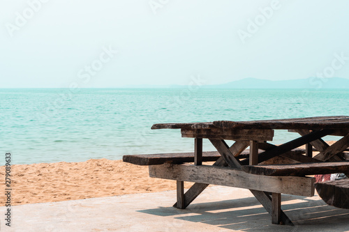 Old empty wooden park beach bench on the sea shore , rest relax summer background with copy space © ZETHA_WORK