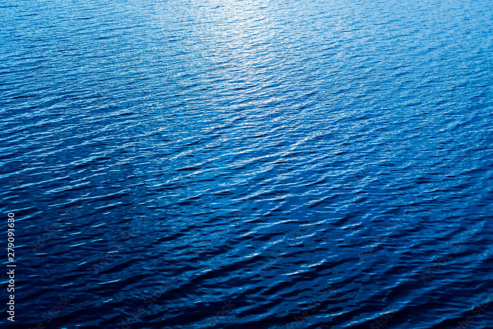 Fototapeta premium aerial view to blue water with reflections