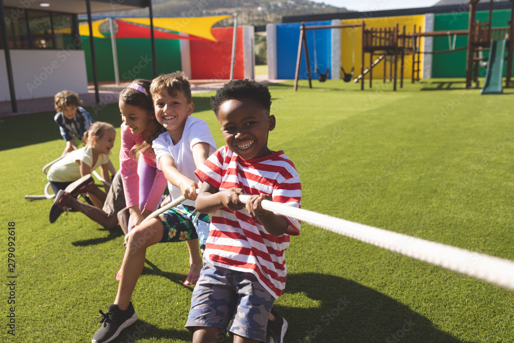 Photo Art Print Group of school kids playing tug of war WavebreakMediaMicro