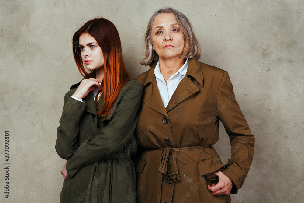 two women in black coats