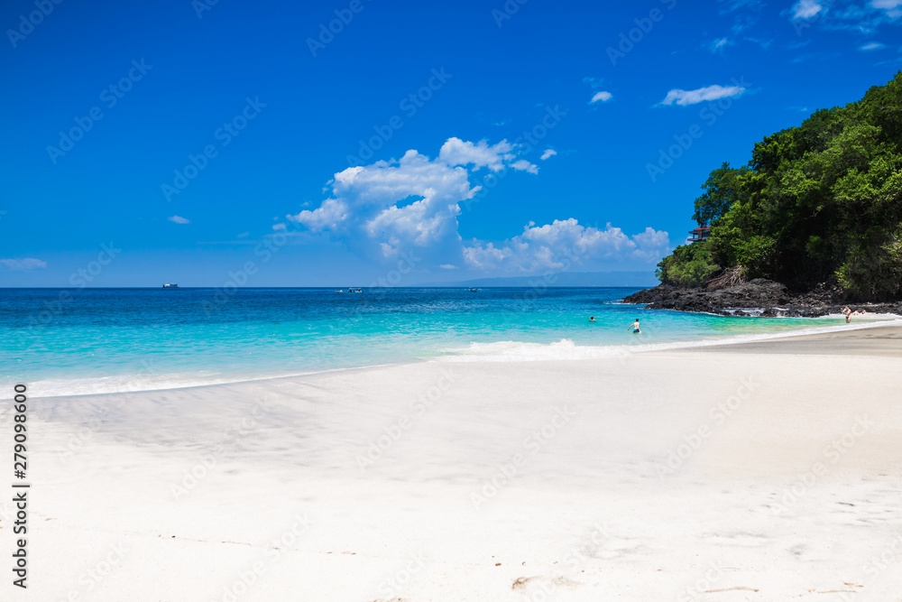 Tropical beach with white sand and blue ocean in Maldives