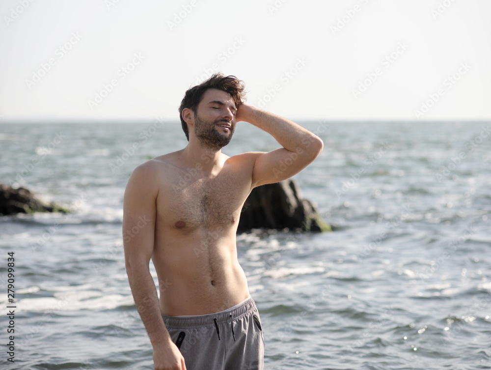 Young stylish man outdoor portrait near the sea Young stylish man outdoor portrait near the sea