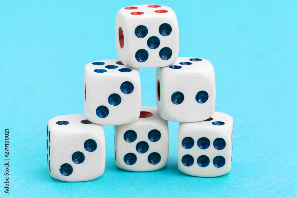 Gaming dices on blue background. Game concept. Gaming dices on blue background. Game concept.