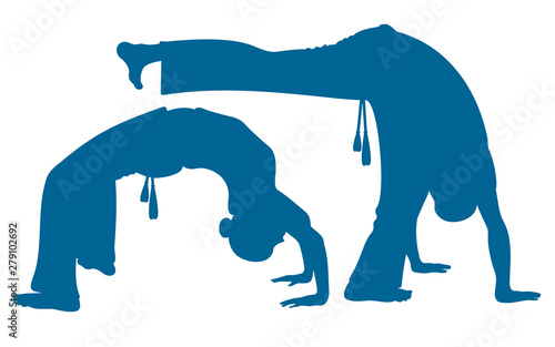 Girl and boy playing capoeira