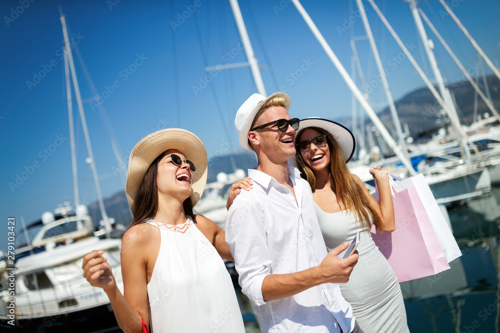 Happy tourist friends having fun on summer travel vacation