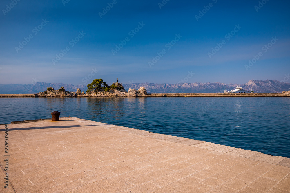Fototapeta premium statue in port small vilage Trpanj in Dalmatia, Croatia; Peljesac peninsula