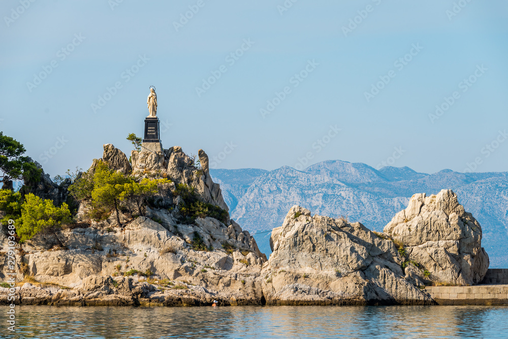 statue in port small vilage Trpanj in Dalmatia, Croatia; Peljesac peninsula