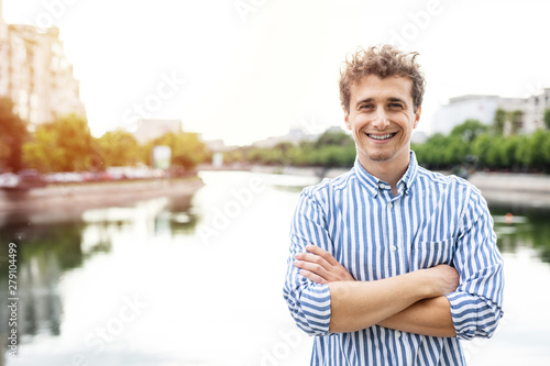 portrait of successful young man in a city photo