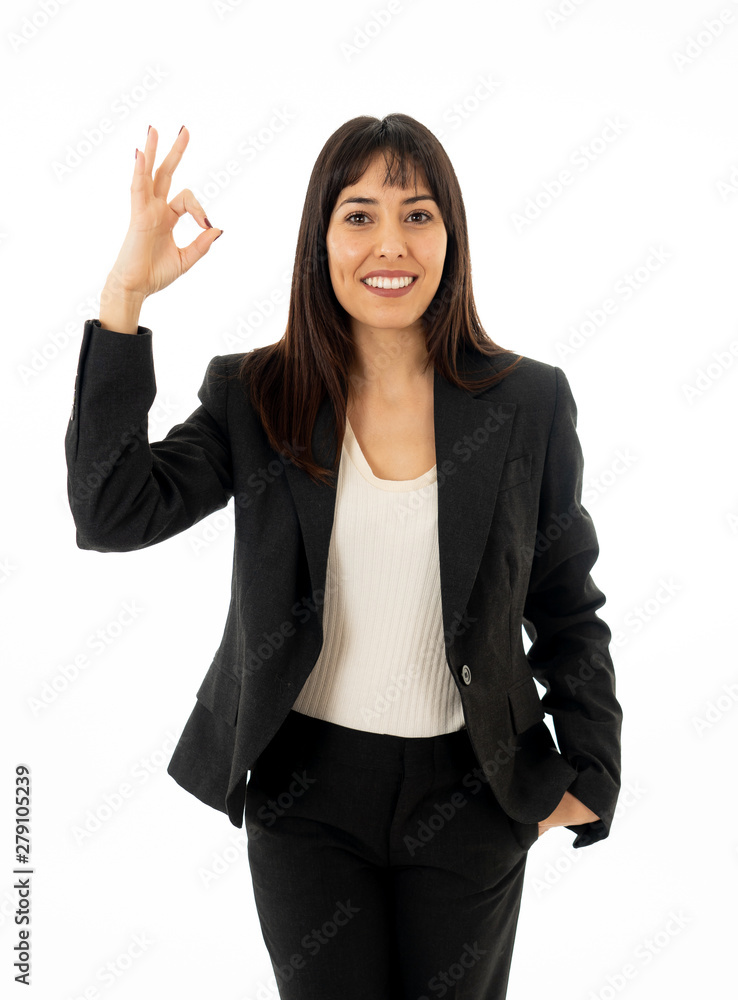 Portrait of a young beautiful smiling business woman doing O.K. sign. Isolated on white background Portrait of a young beautiful smiling business woman doing O.K. sign. Isolated on white background