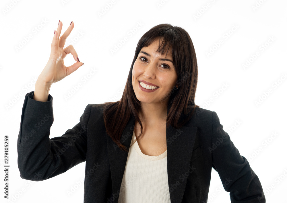 Portrait of a young beautiful smiling business woman doing O.K. sign. Isolated on white background Portrait of a young beautiful smiling business woman doing O.K. sign. Isolated on white background