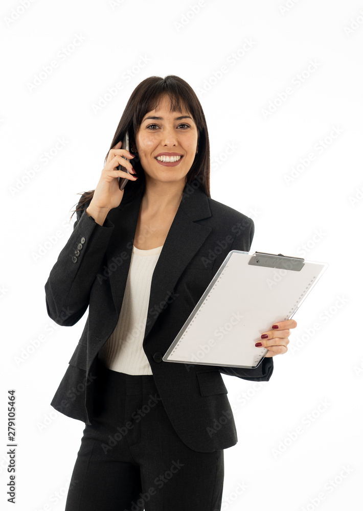 Portrait of a young business woman talking on phone holding a fo Portrait of a young business woman talking on phone holding a fo
