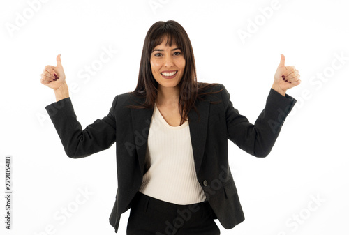 Portrait of a young beautiful smiling business woman showing thumb up. Isolated on white background