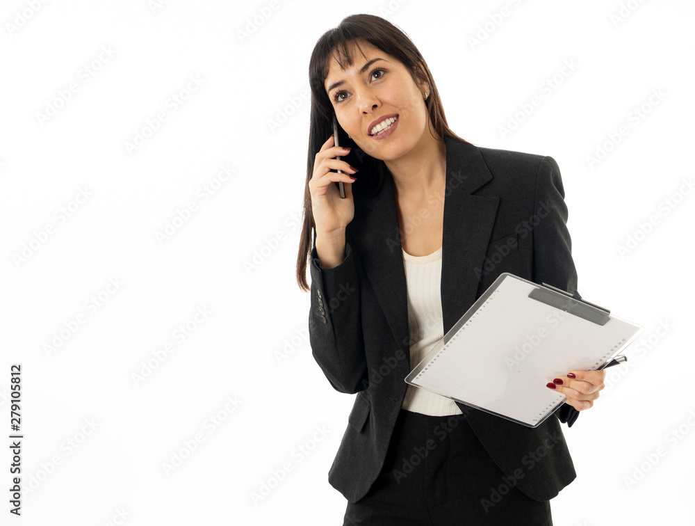 Portrait of a young business woman talking on phone holding a fo Portrait of a young business woman talking on phone holding a fo