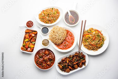 Assorted Indo chinese dishes in group includes Schezwan/Szechuan hakka noodles, veg fried rice, veg manchurian, american chop suey, chilli paneer, crispy vegetable and vegetable soup