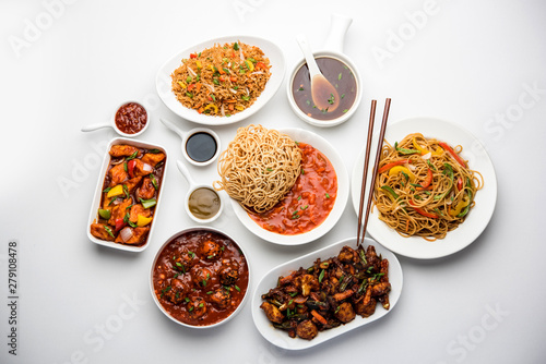 Assorted Indo chinese dishes in group includes Schezwan/Szechuan hakka noodles, veg fried rice, veg manchurian, american chop suey, chilli paneer, crispy vegetable and vegetable soup