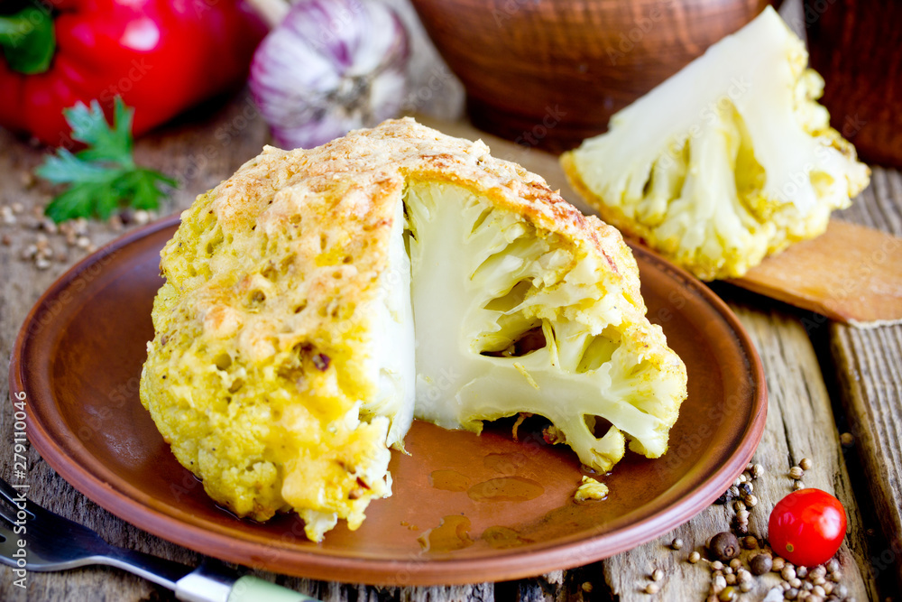 Whole roasted spicy cauliflower with crusty cheese bread crumb crust