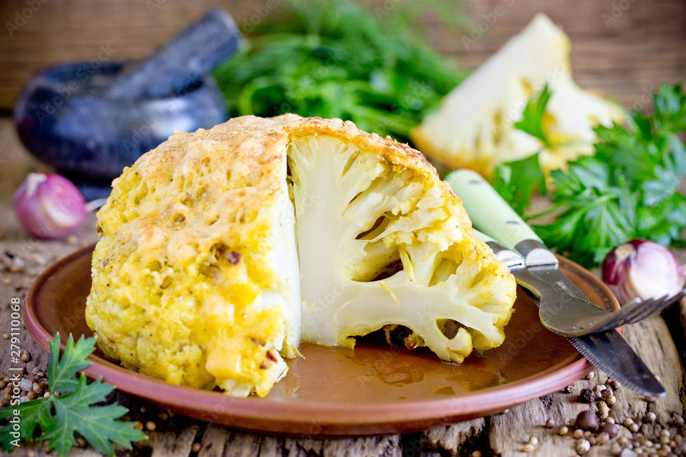 Whole roasted spicy cauliflower with crusty cheese bread crumb crust