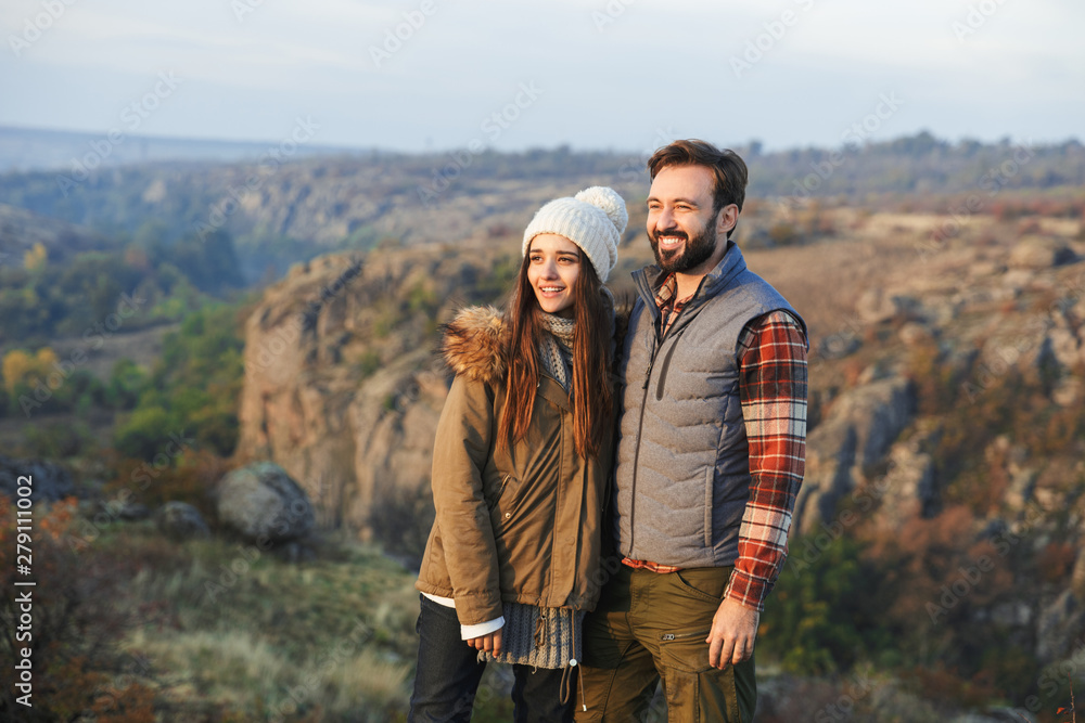 Amazing emotional happy young loving couple outside in free alternative vacation camping over mountains.