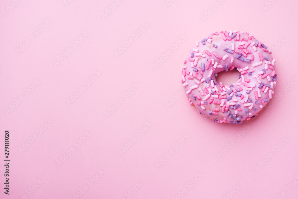 Pink doughnut on a pink background. Top view Flat lay. Pink doughnut on a pink background. Top view Flat lay.
