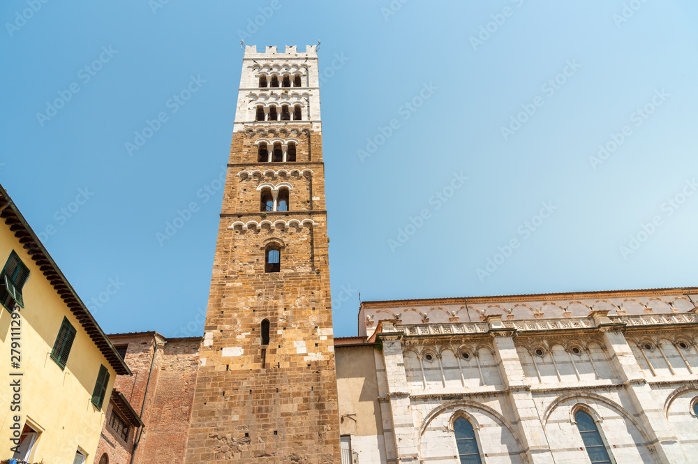Romanesque Facade and bell tower of St. Martin Cathedral in Lucca, Tuscany.