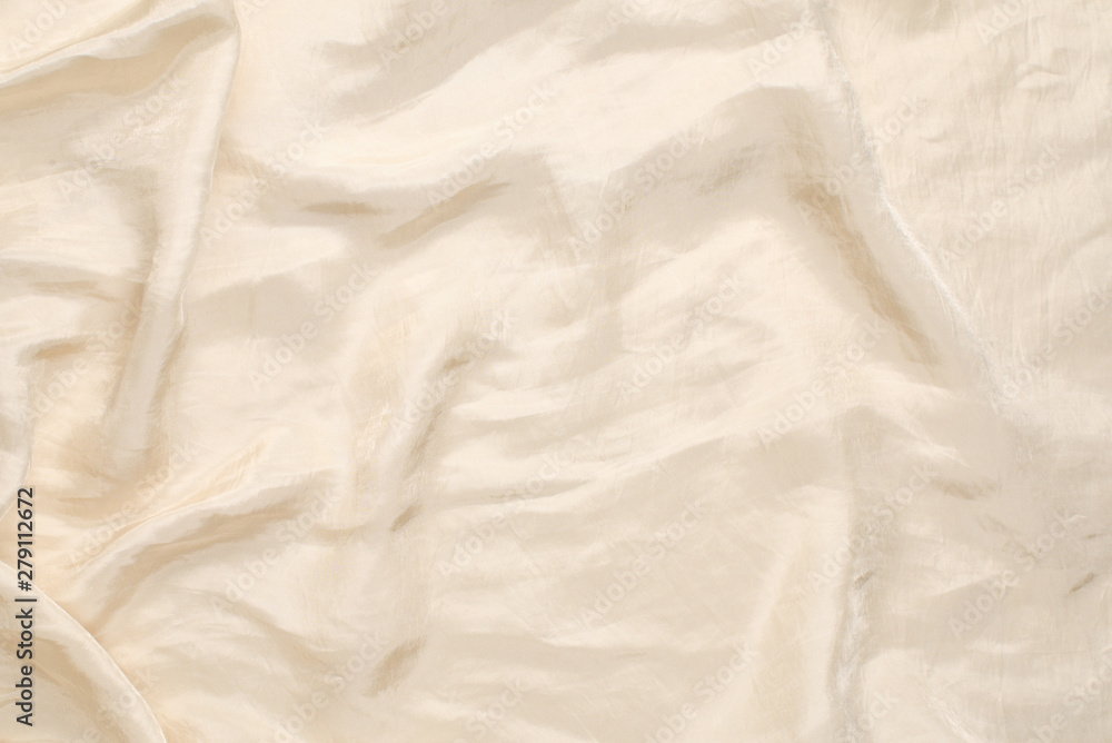 Soft smooth beige silk fabric background. Fabric texture. Soft smooth beige silk fabric background. Fabric texture.