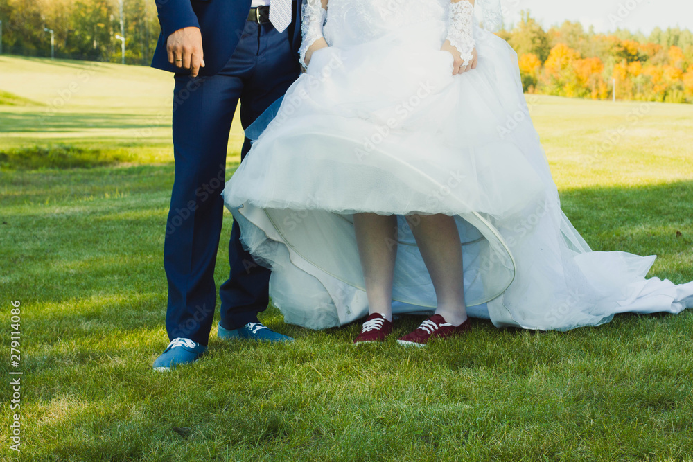 bride and groom on green grass bride and groom on green grass