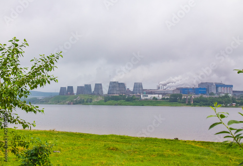 Industrial metallurgical district of Krasnoturinsk away behind the lake photo