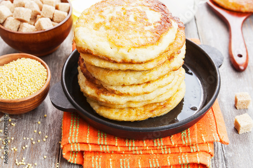Millet pancakes in a frying pan