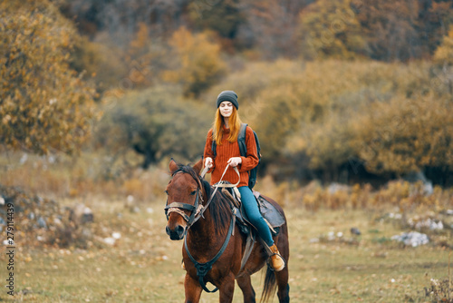 young woman riding a horse © SHOTPRIME STUDIO