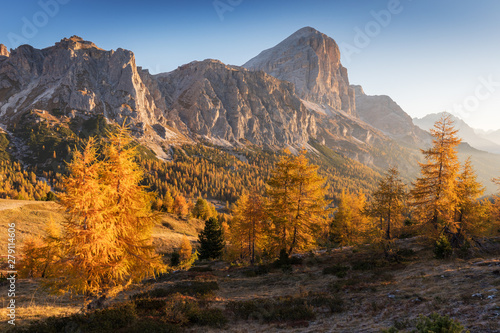 Autumn landscape on a sunny day in the Italian Dolomites. View of Tofana di Rozes. Dolomites. Cortina d'Ampezzo, Veneto. Italy Dolomite Alps near Falzarego Pass, Italy.