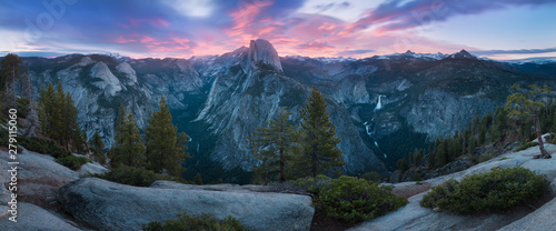 Half Dome and Yosemite Valley in Yosemite National Park during colorful sunrise with trees and rocks. California, USA Sunny day in the most popular viewpoint in Yosemite Beautiful landscape background photo